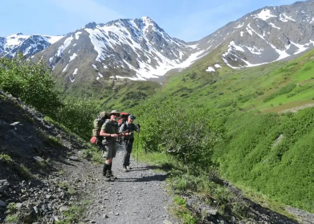 backpacking near snow capped mountains