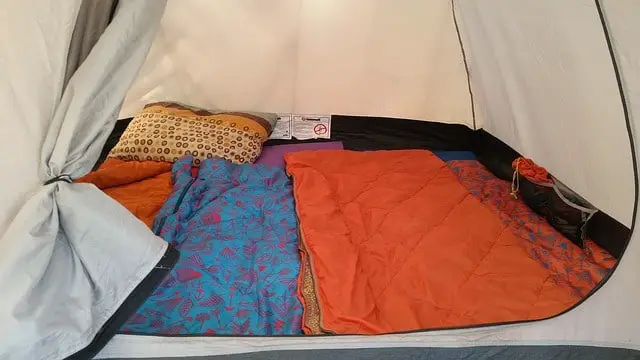 A tent with sleeping bags inside